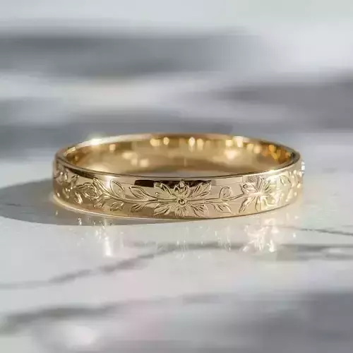Gold Ring with Artistic Floral Engraving and Elegant Design