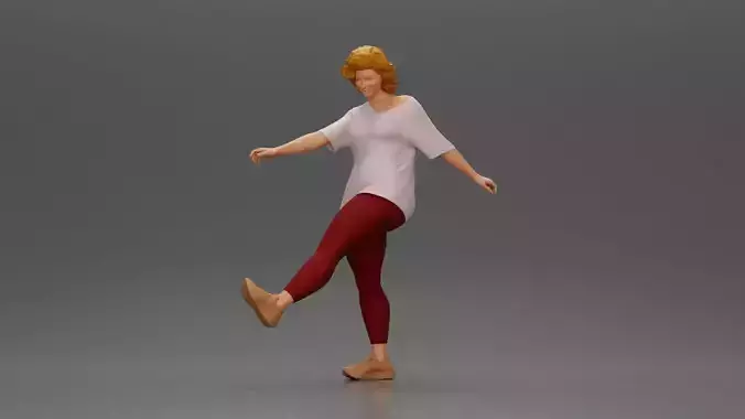 Woman in casual outfit joyfully kicks her leg with energy