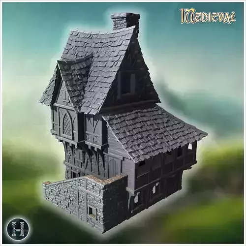 Large medieval house with steep roofs timber framing and stone w