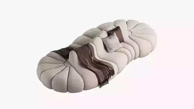 Curved modular sofa with pillows and a throw