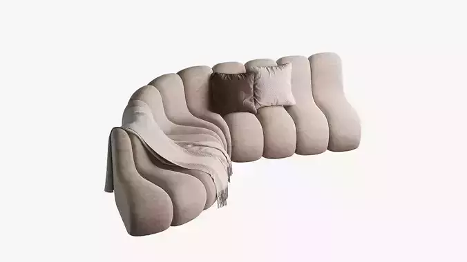 Curved modular sofa with two pillows and a throw