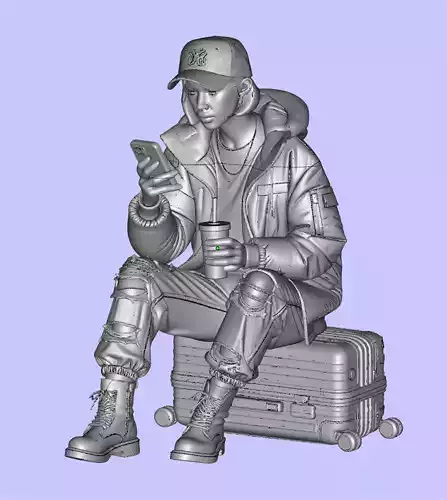 Girl sitting on a suitcase and looking at her cell phone