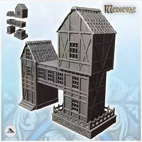 Large medieval half-timbered building with suspended storey and 