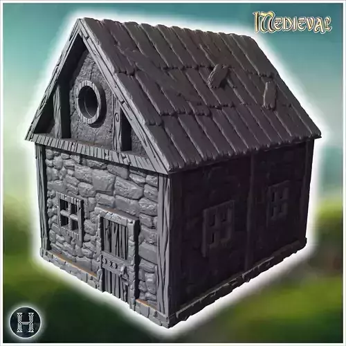 Small medieval stone cottage with wooden door circular window an