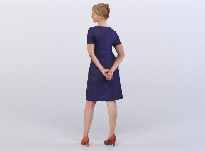 Anna 0033 Woman in a blue dress arms behind her back