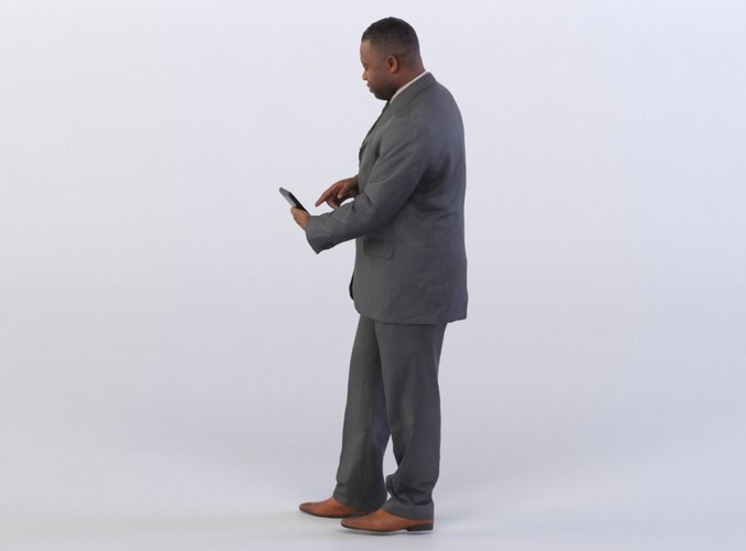 Ray 0317 Man in a suit typing on a tablet
