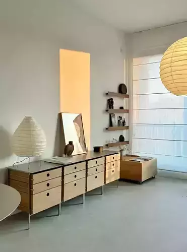 Scandinavian Living Room with Modular Dresser and Paper Lanterns