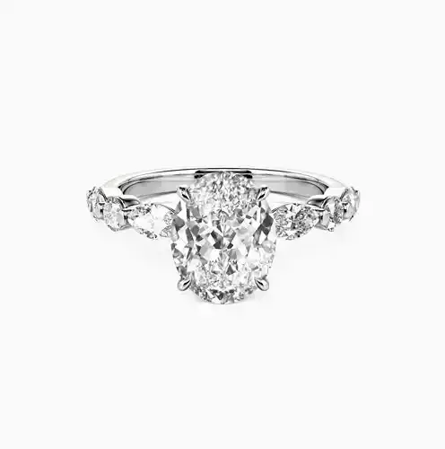 Oval cut side stone engagement ring