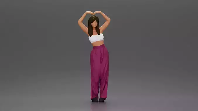 woman striking a heart-shaped pose with joyful energy