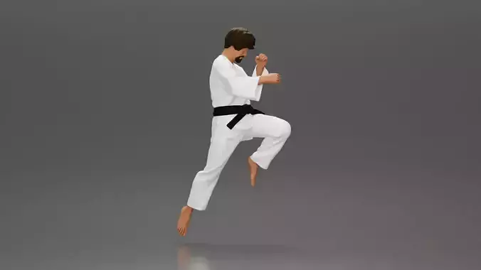 Karate Practitioner in Gi Performing a Jumping Martial Arts Move
