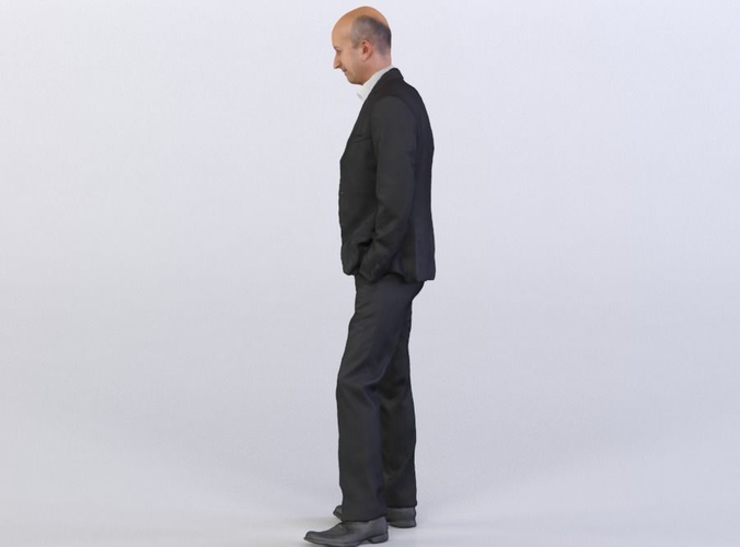 Dave 0150 Man in a suit looking down, Arms in Pockets