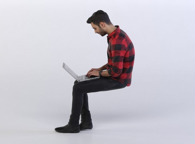Elias 0385 Man Sitting, Typing on a Laptop