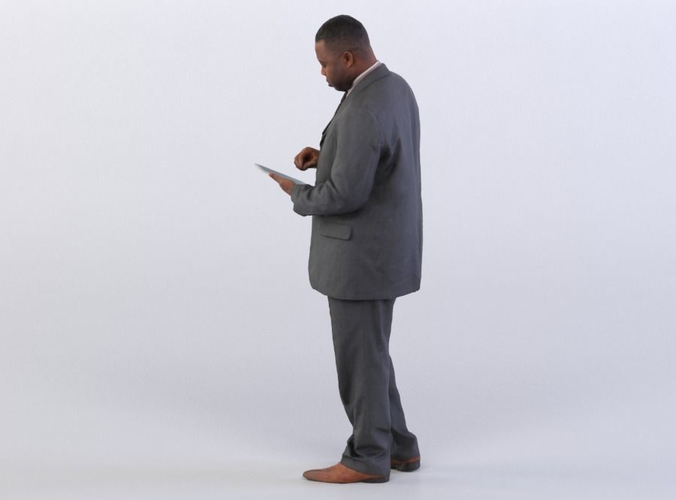 Business Man 0319 in a Suit Using a Tablet