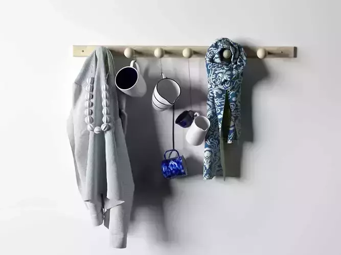 Blue Fabrics and Cups Composition on Rack