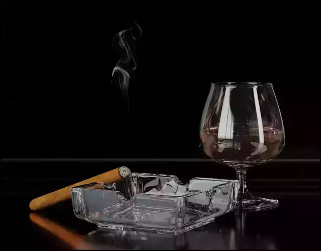 Whiskey with ashtray and cigar