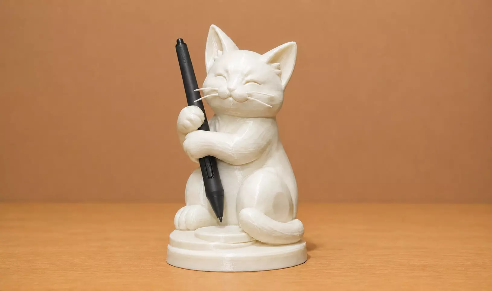 Cute Cat Holding a Pen 3D print model