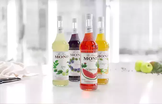 Syrup set four bottles of monon juice on table 3D model
