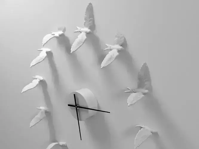 Swallow clock made of paper birds