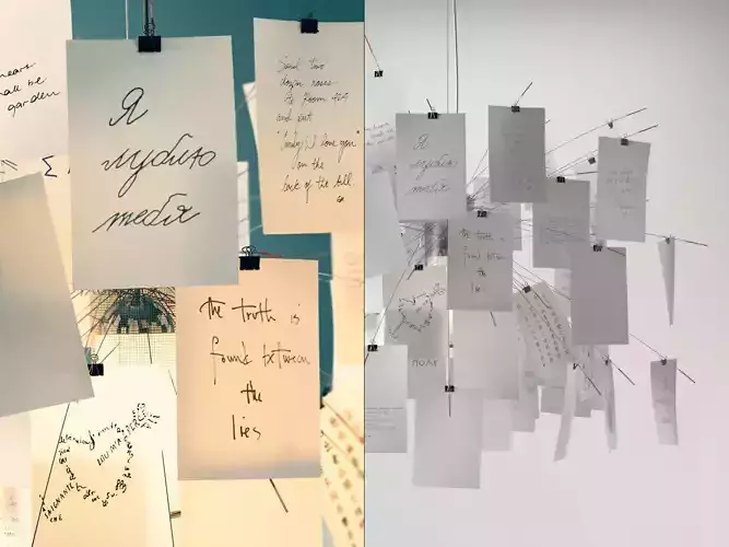 Zettelz 6 light fixture with paper hanging from it