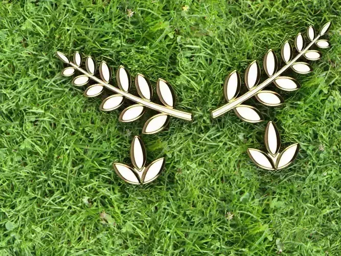 Earring pair of earrings with leaves on grass