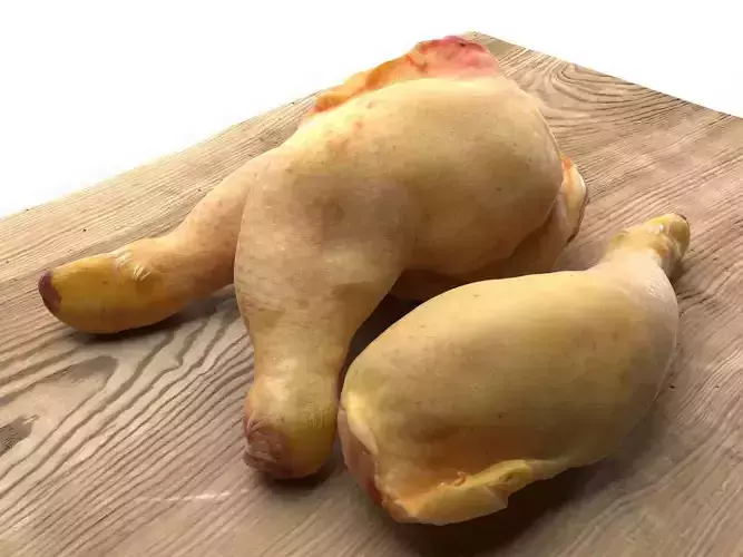 Meat 8 three chicken legs on wooden table