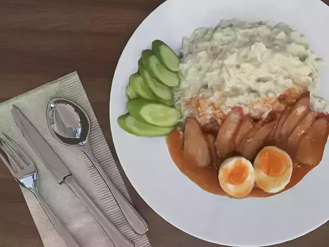 Plate of Food Egg and Cucumber in sauce - 