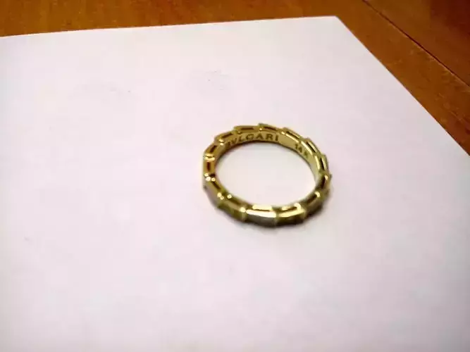 Light ring with white pearl enamel and diamonds