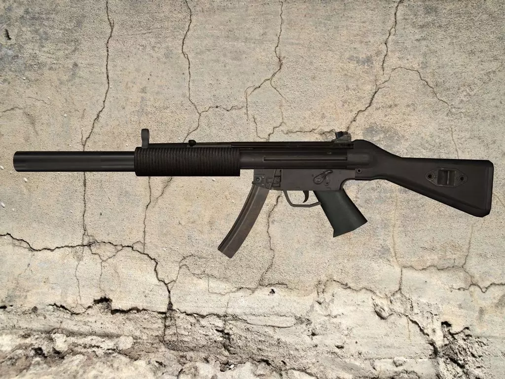 MP5-SD gun on concrete wall Low-poly 3D model_0