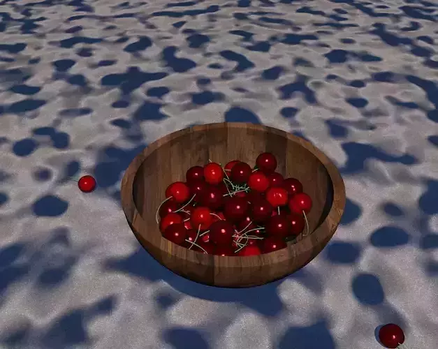 a bowl of cherry on beach