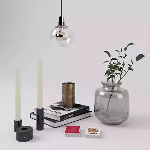 Decorative Set with books candles cards plant Occhio lamp